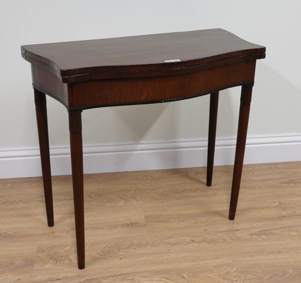 A 19TH CENTURY FRENCH SERPENTINE MAHOGANY CARD TABLE