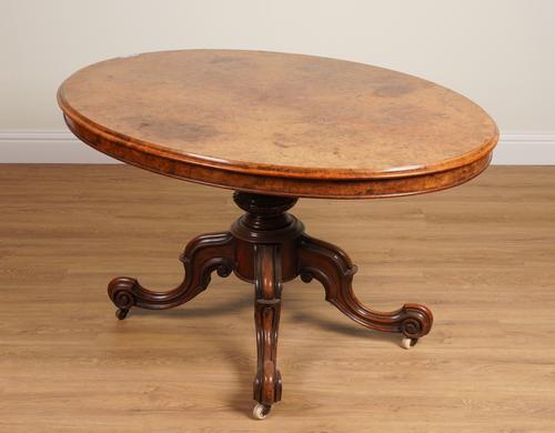 A VICTORIAN FIGURED WALNUT OVAL SNAP TOP CENTRE TABLE