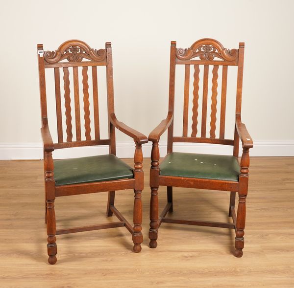 A PAIR OF MID 20TH CENTURY OAK OPEN ARMCHAIRS (2)