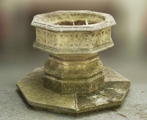 A RECONSTITUTED STONE GOTHIC REVIVAL OCTAGONAL FONT/PLANTER