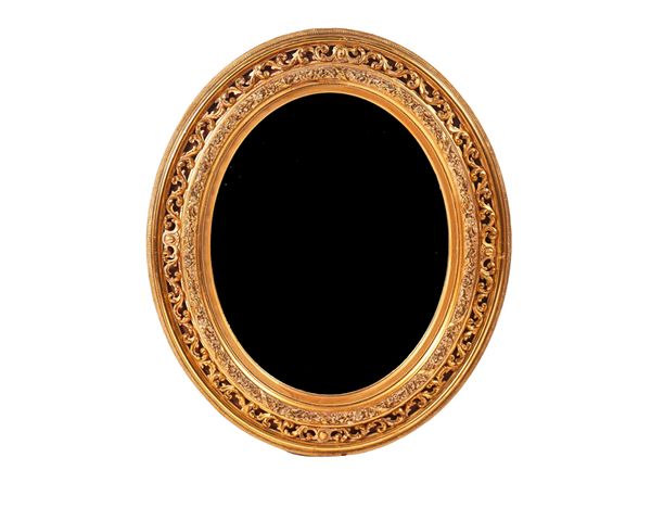 AN EARLY 20TH CENTURY GILT FRAMED OVAL MIRROR