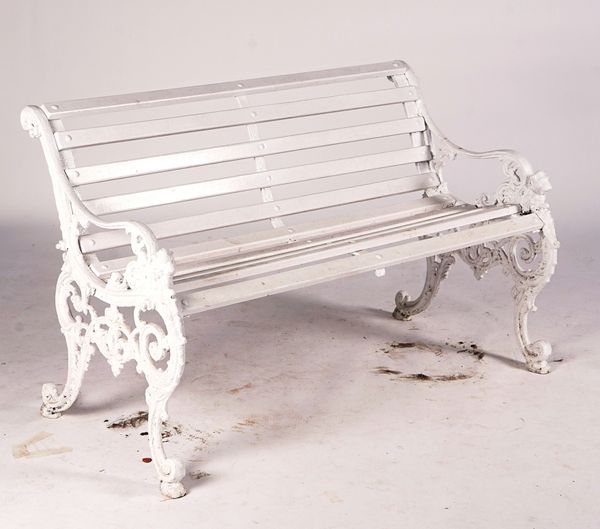 ANDREW McLAREN & Co; A 19TH CENTURY WHITE PAINTED CAST IRON GARDEN BENCH