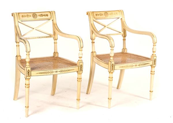 A PAIR OF REGENCY STYLE PARCEL GILT CREAM PAINTED OPEN ARMCHAIRS (2)