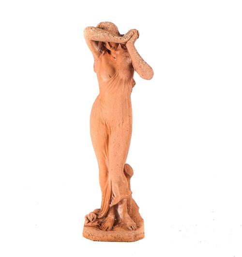 A RECONSTITUTED STONE FIGURE OF A SCANTILY CLAD FEMALE