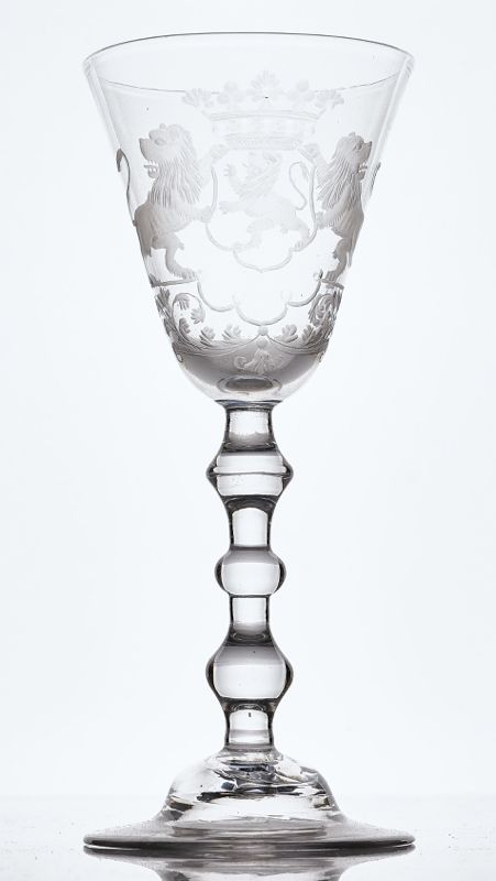 A DUTCH ENGRAVED ARMORIAL LIGHT BALUSTER WINE GLASS