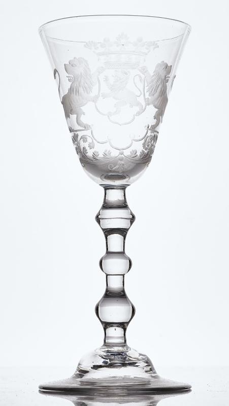 A DUTCH ENGRAVED ARMORIAL LIGHT BALUSTER WINE GLASS