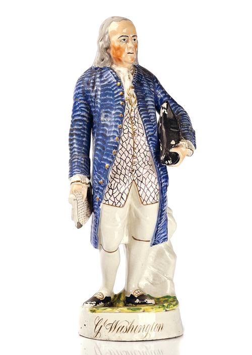 A STAFFORDSHIRE POTTERY FIGURE OF `GEORGE WASHINGTON'