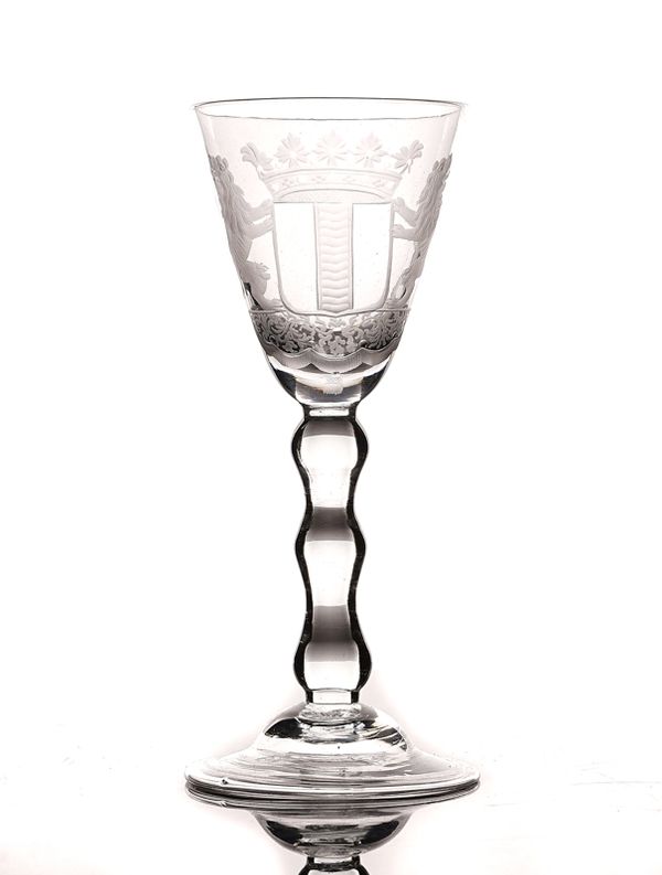 A DUTCH ENGRAVED ARMORIAL WINE GLASS