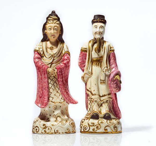 A PAIR OF UNSUSUAL ENGLISH PORCELAIN FIGURES OF A CHINESE OFFICIAL AND WIFE