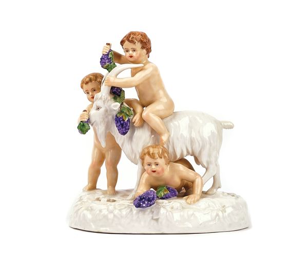 A COPENHAGEN PORCELAIN GROUP OF THREE PUTTO WITH A GOAT