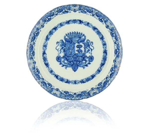 A LARGE DUTCH DELFT ARMORIAL BLUE AND WHITE DISH