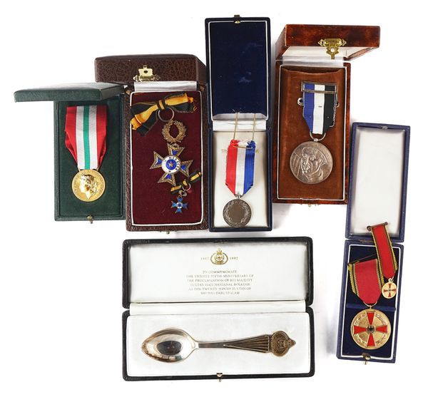 A SILVER SPOON AND A QUANTITY OF FOREIGN AWARDS  (QTY)