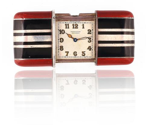 A MOVADO SILVER AND ENAMELED RECTANGULAR FOLDING WATCH