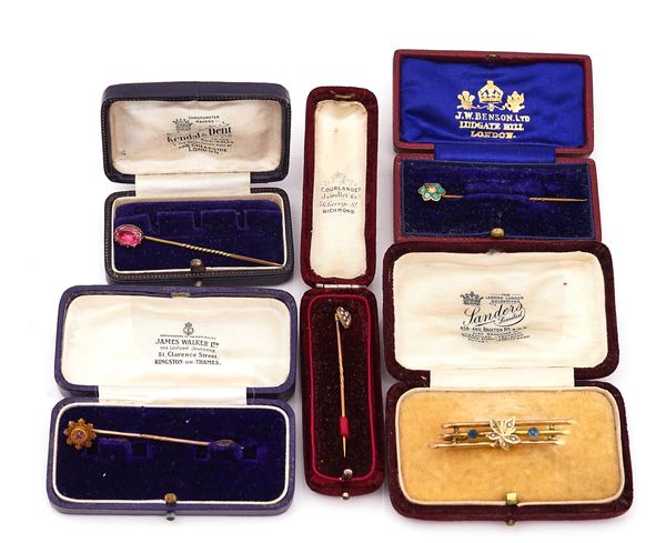 A GOLD, SEED PEARL AND BLUE GEM SET BAR BROOCH AND FOUR STICK PINS (5)
