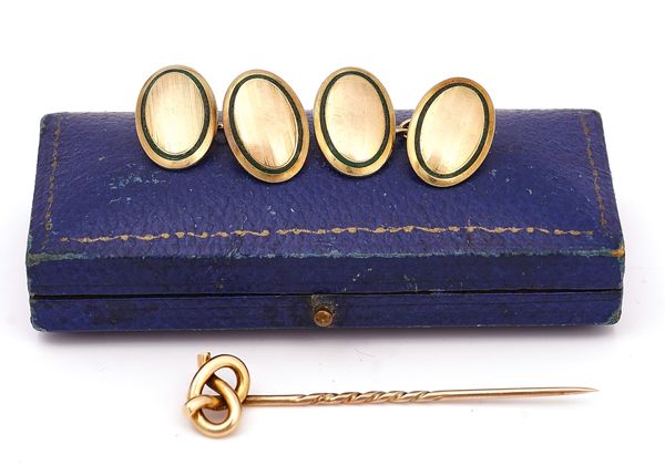 A  PAIR OF GOLD AND ENAMELLED CUFFLINKS AND A STICK PIN (2)