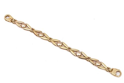 A TWO COLOUR GOLD BRACELET
