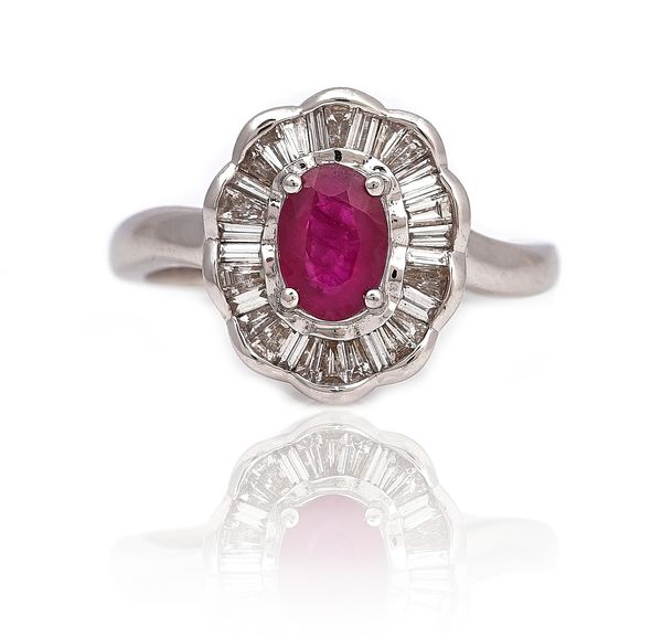 AN 18CT WHITE GOLD, RUBY AND DIAMOND SHAPED OVAL CLUSTER RING