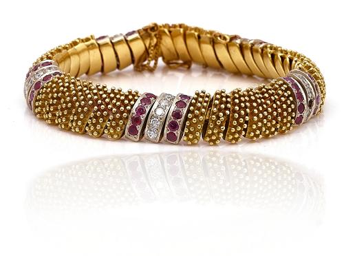 A GOLD, RUBY AND DIAMOND BRACELET