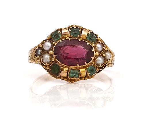 A VICTORIAN 15CT GOLD, GARNET AND GEM SET OVAL CLUSTER RING