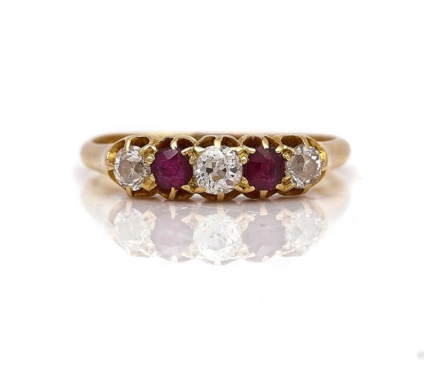 A GOLD, RUBY AND DIAMOND FIVE STONE RING