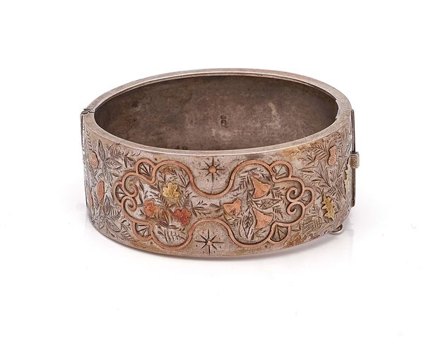 A VICTORIAN SILVER OVAL HINGED BANGLE