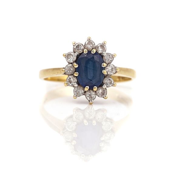 AN 18CT GOLD, SAPPHIRE AND DIAMOND OVAL CLUSTER RING