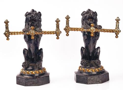 A PAIR OF VICTORIAN CAST IRON AND BRASS FIRE DOGS / TOOL RESTS