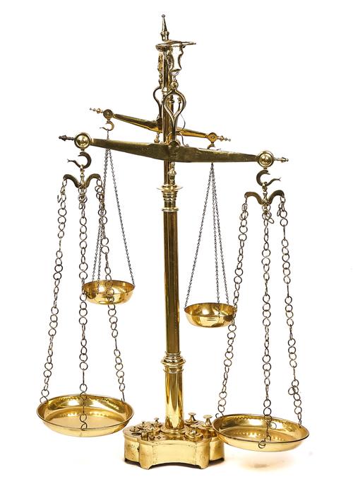 A SET OF PORTUGUESE FLOOR STANDING POLISHED BRASS BUTCHER’S WEIGHING SCALES