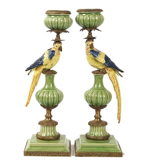 A PAIR OF METAL-MOUNTED CERAMIC CELADON AND POLYCHROME PARROT CANDLESTICKS (2)