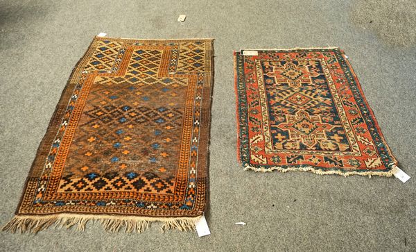 A HERIZ RUG AND A BELUCH RUG (2)