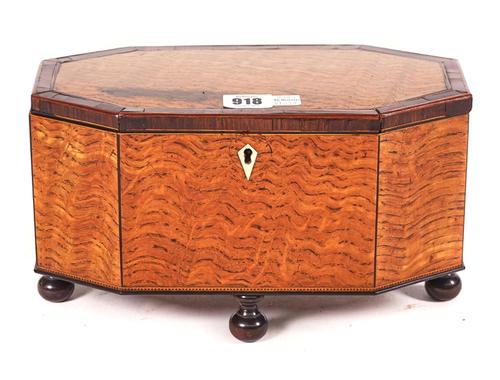 AN EARLY 19TH CENTURY LACEWOOD TEA CADDY