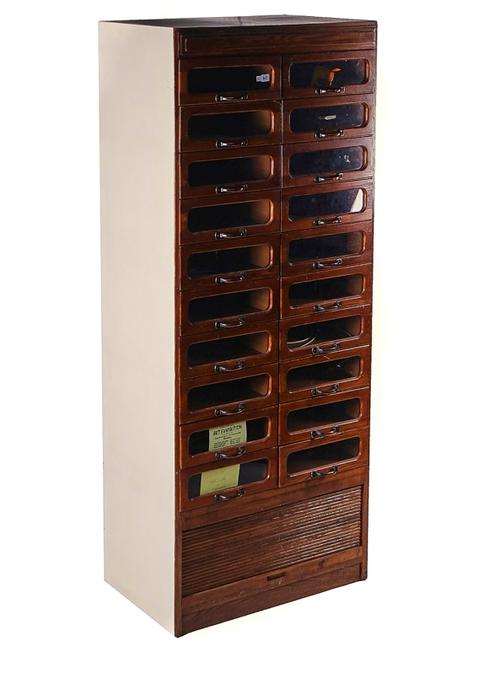 A MID-20TH CENTURY OAK HABERDASHERY CABINET