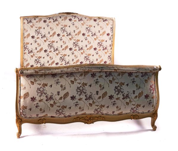 A LOUIS XV STYLE CREAM PAINTED PARCEL-GILT DOUBLE BED