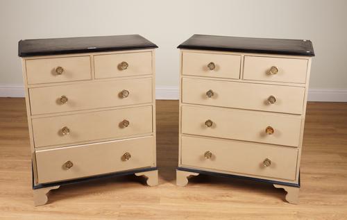 A PAIR OF EBONISED AND PALE OCHRE PAINTED CHESTS OF DRAWERS (2)