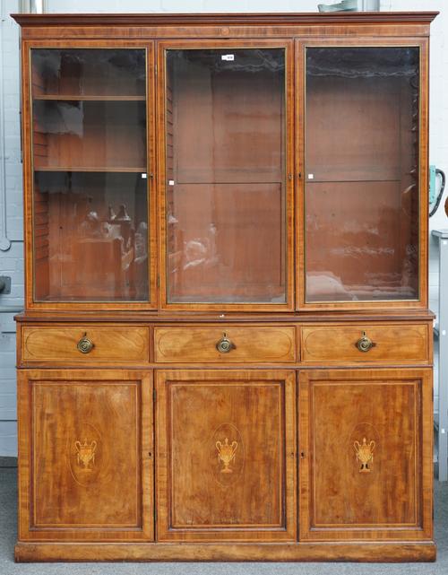 EDWARDS AND ROBERTS; A GEORGE III INLAID MAHOGANY BOOKCASE CABINET