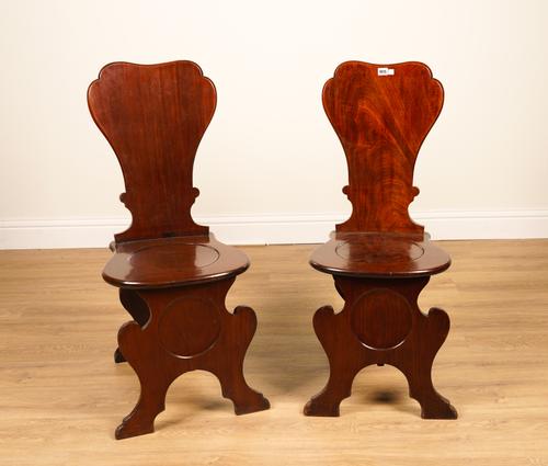 A PAIR OF 18TH CENTURY MAHOGANY SILHOUETTE BACK HALL CHAIRS (2)