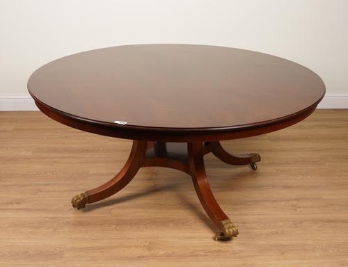 AFTER JUPE JOHNSTONE AND JEANES; A CIRCULAR MAHOGANY EXTENDING DINING TABLE