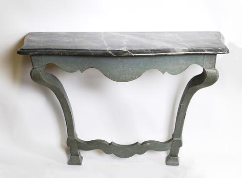 A GREY MARBLE TOPPED SERPENTINE CONSOLE TABLE