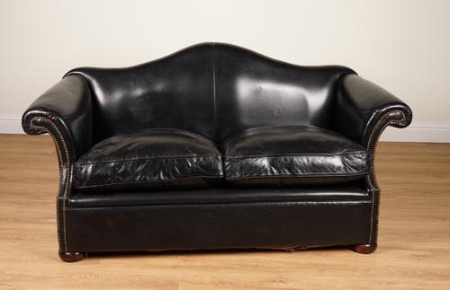 A STUDDED BLACK LEATHER UPHOLSTERED HUMP BACK TWO SEATER SOFA