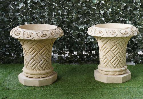 A PAIR OF RECONSTITUTED STONE JARDINIERES WITH LATTICE WORK BODIES (2)