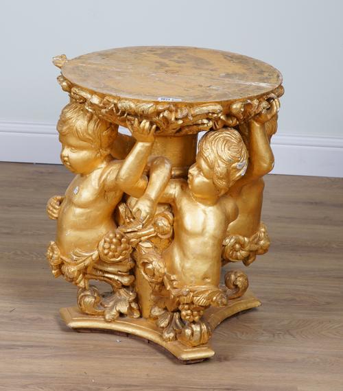 A 19TH CENTURY GILTWOOD TABLE BASE FORMED AS FOUR OPPOSING CHERUBS