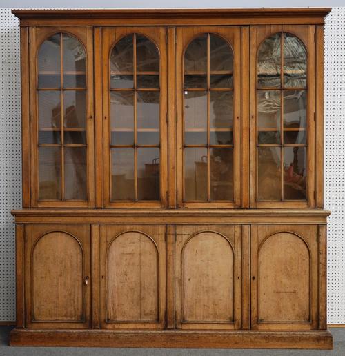 A VICTORIAN OAK FOUR SECTION BOOKCASE CABINET