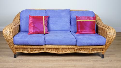 A CANE WORK THREE-SEAT SOFA