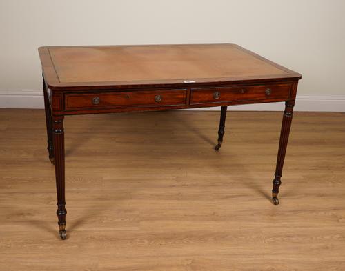 A REGENCY EBONY STRUNG MAHOGANY TWO DRAWER WRITING TABLE