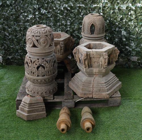 A PAIR OF TERRACOTTA LANTERNS WITH TURNED FINIALS AND OPPOSING ELEPHANT BASES (2)