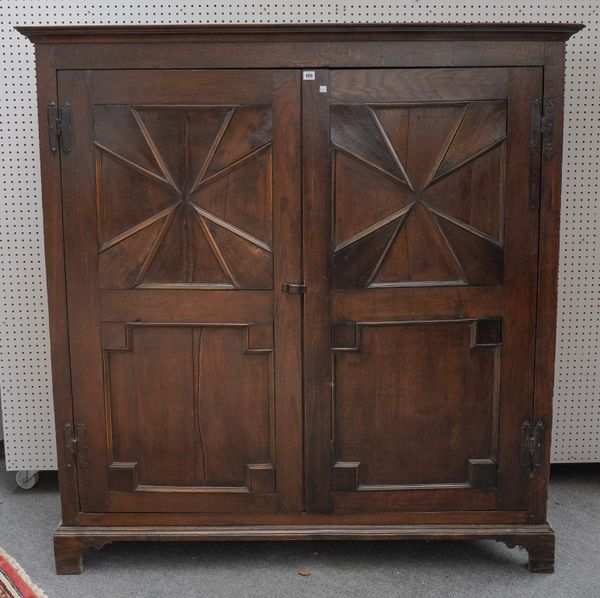 A 17TH CENTURY AND LATER OAK HALL CUPBOARD