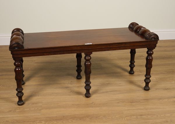 A 19TH CENTURY MAHOGANY WINDOW SEAT ON SIX TURNED SUPPORTS