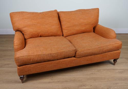 A MODERN ORANGE UPHOLSTERED TWO SEAT SOFA