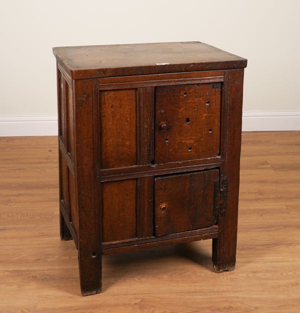 A 17TH CENTURY PROVINCIAL OAK PANELLED CUPBOARD WITH ASSOCIATED TOP