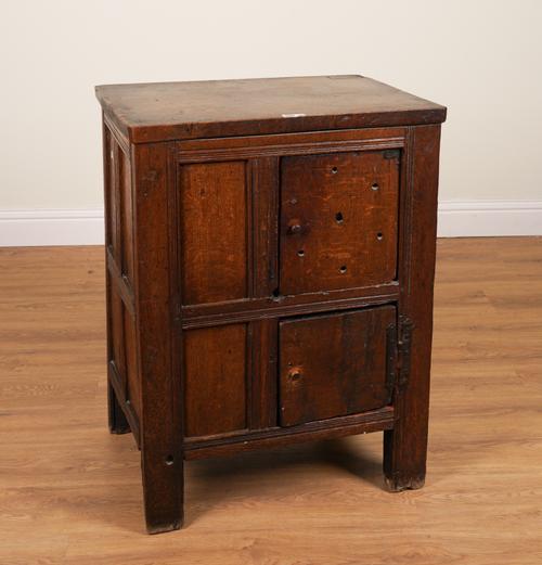 A 17TH CENTURY PROVINCIAL OAK PANELLED CUPBOARD WITH ASSOCIATED TOP